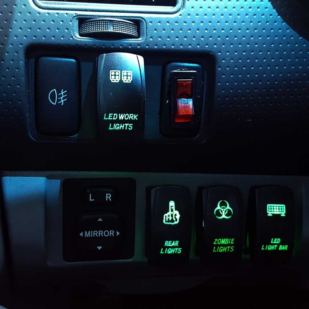 Various rocker switches with green backlight.